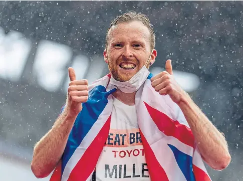  ??  ?? THUMBS UP: Owen Miller celebrates his gold medal in the men’s 1,500m final at the Tokyo Paralympic­s.