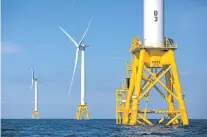  ?? MICHAEL DWYER/ASSOCIATED PRESS FILE PHOTO ?? Three wind turbines from the Deepwater Wind project stand in 2016 in the Atlantic Ocean off Block Island, R.I. Fishermen are turning a wary eye toward an emerging upstart: the offshore wind industry.