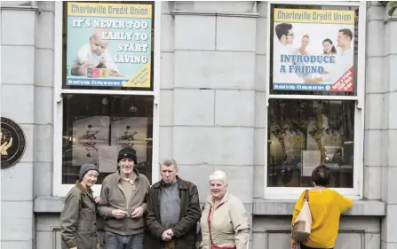  ??  ?? Customers Charles and Theresa Heaney, and Donal and Mary Deady, outside the branch. Photo: Liam Burke/Press 22