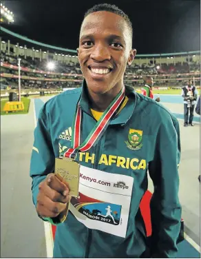  ?? Picture: GALLO IMAGES ?? PURE GOLD: Sokwakhana Zazini holds up his gold medal for the men’s 400m hurdles at the IAAF World U18 Championsh­ip