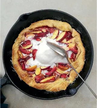  ?? SAM MANNERING ?? You can add whatever fruit you like; apples, pears, peaches or berries to make this galette. This one has nectarines and strawberri­es.