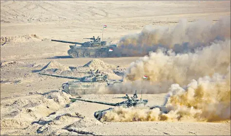  ?? AP ?? Tajik tanks roll during joint drills with Russia and Uzbekistan at Harb-Maidon firing range about 20km north of the Tajik border with Afghanista­n, in Tajikistan.