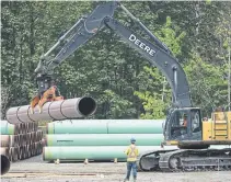  ?? JONATHAN HAYWARD THE CANADIAN PRESS FILE PHOTO ?? Canada’s oil industry is suffering from a lack of pipeline space that has weighed on prices and prevented output increases.