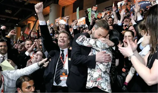  ?? JOSHUA BERSON ?? Mulcair hugs his wife, Catherine, after being elected federal NDP leader on April 24, 2012. It was the culminatio­n of a contest that followed the death of Layton.