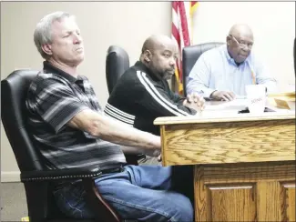  ?? Brodie Johnson • Times-Herald ?? St. Francis County Quorum Court Justices, from left, David Coleman, Kendall Owens and Charles Jones, discuss business during Tuesday’s meeting. County Judge Craig Jones told justices he has purchased two trucks for the county’s solid waste department.