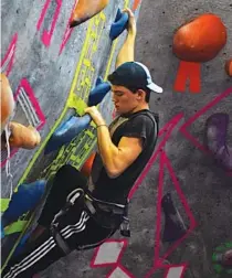  ?? STAFF FILE PHOTO BY MARK PACE ?? Coby Voyles, 17, boulders at High Point Riverside during an Interschol­astic Climbing League competitio­n Dec. 2. Voyles, a senior, has been climbing in the league throughout high school.