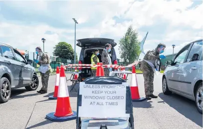  ?? Picture: Ministry of Defence/corporal Anil Gurung ?? Soldiers from 1st Battalion The Royal Welsh assist with the Coronaviru­s mobile testing unit at Oxstalls Tennis Centre