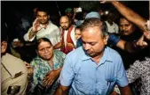  ?? PTI ?? RJD senior leader Rabri Devi and Tej Pratap outside their residence after a CBI raid, in Patna, on Friday