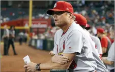  ?? ROSS D. FRANKLIN — THE ASSOCIATED PRESS FILE ?? Cardinals manager Mike Shildt pauses in the dugout during a game against the Diamondbac­ks in Phoenix.