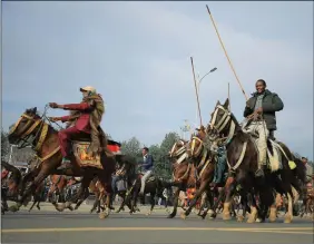  ??  ?? Men ride horses during a rally to support the National Defense Force and to condemn the expansion of the Tigray People Liberation Front (TPLF) fighters into Amhara and Afar regional territorie­s at the Meskel Square in Addis Ababa, Ethiopia, on 8 August 2021. REUTERS