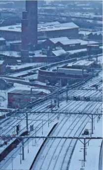  ?? PHILIP HAIGH. ?? In the snow of December 28 2000, Railtrack and its contractor­s work to remodel Leeds station’s western approaches. Twenty years on, West Yorkshire Combined Authority is promoting an ambitious scheme of rail improvemen­ts that it hopes will tempt people from cars to trains.