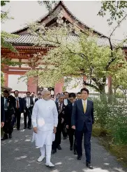  ??  ?? Prime Minister Narendra Modi and Japanese PM Shinzo Abe during their visit to the Toji Temple in Kyoto, western Japan, on Sunday. —