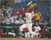  ?? MITCHELL LEFF – GETTY IMAGES ?? In the first inning, Bryce Harper of the Phillies slugs the first of his three homers against the Reds on Tuesday night.