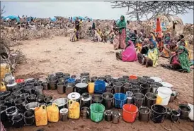  ?? MULUGETA AYENE/AP ?? People wait for food and water Saturday in Warder, a Somali region of Ethiopia.