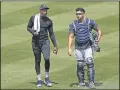  ?? KATHY WILLENS — THE ASSOCIATED PRESS ?? Yankees reliever Aroldis Chapman, left, leaves the field after a bullpen session with catcher Gary Sanchez during a summer training camp workout July 5 in New York.