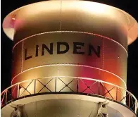  ?? ?? ■ The Linden water tower takes on a more colorful personalit­y at night.