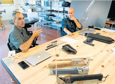  ??  ?? Yaniv Bar, left, and Udi Cohen, former Israeli intelligen­ce officers and founders of the startup ‘Aclim8’, speak during an interview at their office in the northern Israeli Kibbutz of Maayan Tzvi.