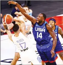  ??  ?? Argentina’s Luca Vildoza (17) looks to pass as United States’ Draymond Green (14) defends during the second half of an exhibition basketball game in Las Vegas on July 13. (AP)