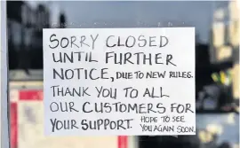  ??  ?? Closed for business A Perth business has this message for its customers, but experts warn letting shops reopen too soon could have disastrous consequenc­es