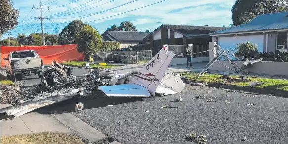  ?? Picture: HERALD SUN ?? Pilot Anthony Liddell was killed when his plane crash-landed in a street in Melbourne on June 8. Pictured is the crash scene, three days later.