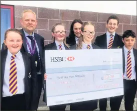  ??  ?? Pictured: Principal Matthew Parrott stands with students of Iveshead School.