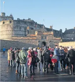  ?? Picture: PA. ?? Tourists wait for their turn to pay a visit to Edinburgh Castle.