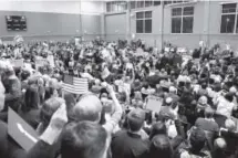  ??  ?? A standing-room-only crowd fills the gymnasium of Byers Middle School on Friday night. More than 1,100 people where estimated to have attended the event, according to organizers.