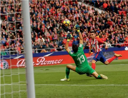  ?? AP ?? Atletico Madrid’s Angel Correa (right) challenges Girona’s goalkeeper Yassine Bounou during a Spanish La Liga match. —