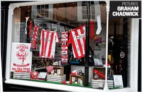  ??  ?? Vintage year: fans can celebrate with club wine (red and white, of course) while Imps gear fills the FP Watson chemists’ window