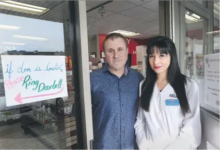  ?? DAN JANISSE ?? After two dangerous intruders broke into their business Lifestyle Pharmacy, owners Peter and Marilyn Adamo have decided the safest thing to do is lock the doors around the clock and control who can enter the premises with external cameras and remote...