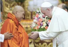  ?? — Reuters ?? Pope Francis shakes hands with Bhaddanta Kumarabhiv­asma, chairman of the state Sangha Maha Nayaka Committee, during a meeting with the Buddhist committee in Yangon on Wednesday.