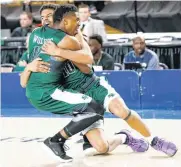  ??  ?? Edmond Santa Fe’s Ben Smith, back, and Tyus Jeffries celebrate after beating Broken Arrow 59-54 in a Class 6A semifinal Friday in Tulsa.