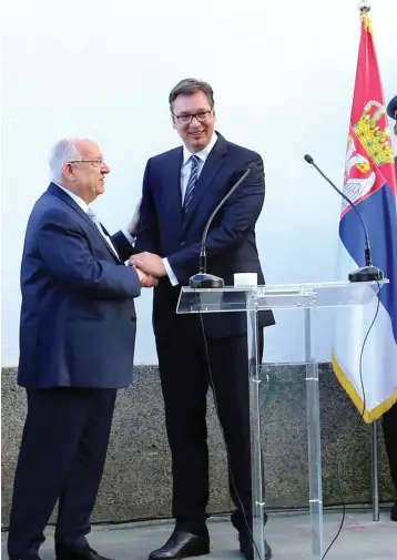  ?? (Secretaria­t for Informatio­n of the City of Belgrade) ?? PRESIDENT REUVEN RIVLIN (left) and Serbian counterpar­t Alexander Vucic attend the dedication of a street named for Theodor Herzl in a Belgrade suburb.