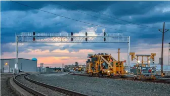  ?? ?? A BNSF track gang works on the 2018 project to quadruple-track a 5-mile section of main line in Amarillo, Texas, making it easier to route priority trains around slower traffic.