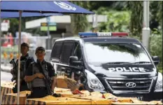  ??  ?? Gurkha police o cers stand guard outside the St. Regis Hotel in Singapore, on Sunday, ahead of the summit between U.S. President Donald Trump and North Korean leader Kim Jong Un. AP PHOTO/YONG TECK LIM