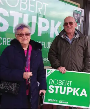  ?? BARB AGUIAR/Special to The Daily Courier ?? Barbara Bowmar and Verne Smythe pick up their B.C. Green sign supporting Kelowna West candidate Robert Stupka at Stupka’s campaign office in West Kelowna Saturday morning.