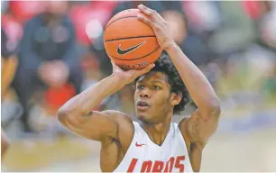  ?? JOHN MOORE/UNIVERSITY OF NEW MEXICO ?? Lobos guard Saquan Singleton had nine points in Wednesday’s 77-45 loss to Utah State in Lubbock. It was UNM’s lowest point total in six years and marked the team’s fifth straight double-digit loss.