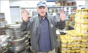  ?? — AFP file photo ?? Julienne gestures next to rolls of films at the Centre for Conservati­on and Research of Toulouse’s film library in Balma, near Toulouse, southern France on Sept 28, 2017.