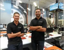  ?? PETE BANNAN — DIGITAL FIRST MEDIA ?? Brothers Andrew and Steve Voudouris, co-founder of Turn5, are shown at the company’s call center.