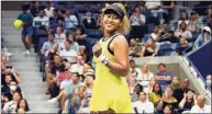  ?? Elise Amendola / Associated Press ?? Naomi Osaka reacts after defeating Marie Bouzkova during the first round of the U.S. Open on Monday.