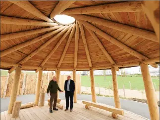  ?? Image: Malcolm Cochrane Photograph­y ?? Patrick Boxall (left), QMU education lecturer, and Graeme Dey MSP, Minister for Higher and Further Education, in the Howff – a hand-crafted wooden shelter with a wildflower roof, skylight dome and windbreak, which can be used as a gathering place or teaching facility.