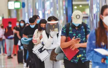  ?? Ahmed Ramzan/ Gulf News ?? Internatio­nal passengers arriving at Terminal 3, Dubai Internatio­nal Airport on Wednesday.
■ Dubai reopened Internatio­nal travel for tourists and residents on July 7.