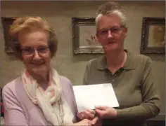  ??  ?? County President Margaret McDermott presenting Alice Devine with a cheque for Castlebrid­ge/Crossabeg, winners of the best Area for 2018.