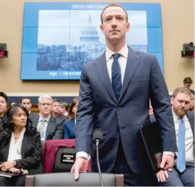  ?? ANDREW HARNIK/ AP ?? Facebook CEO Mark Zuckerberg arrives to testify before a House Energy and Commerce hearing on Capitol Hill Wednesday.