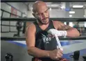  ?? THOMAS HAWTHORNE/THE REPUBLIC ?? Ray Beltran tapes his hands before sparring at Gent's Boxing Club on Aug. 4.