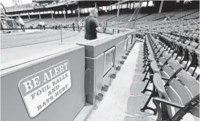  ?? MICHAEL DWYER, AP ?? A warning sign is displayed Saturday in the stands at Fenway Park. Tonya Carpenter was injured by a broken bat during the Red Sox’s game Friday.