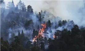  ?? Photograph: RJ Sangosti/AP ?? The Kruger Rock fire continues to burn in Estes Park, Colorado, on Tuesday, 16 November. A wildfire in the town that serves as a gateway to Rocky Mountain National Park has prompted some residents and businesses to be evacuated.