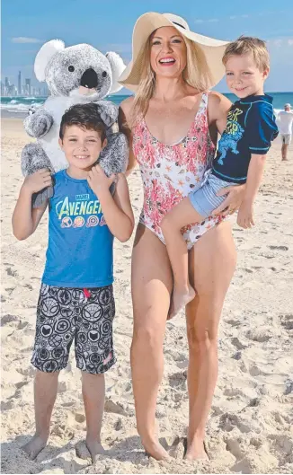  ??  ?? Michelle Massey and sons Hudson and Knoxy will join the Gold Coast Beach Parade next month. Picture: John Pryke