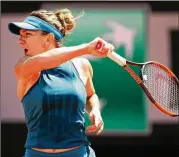  ?? GETTY IMAGES ?? Simona Halep plays a forehand during her semifinal win against Garbine Muguruza. Halep opposes Sloane Stephens for the French Open women’s title.