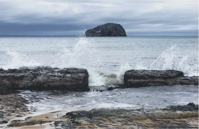  ??  ?? 0 Scotsmman reader Hamish Stewart of North Berwick contribute­s this picture of surf breaking on the beach at Seacliff, with the Bass Rock in the distance